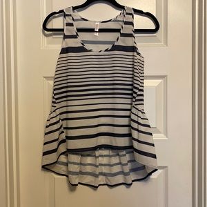 Xhiliration tripped high low tank top